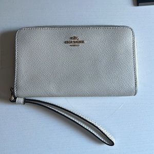 Coach Wallet, white with gold detailing. Wrist strap